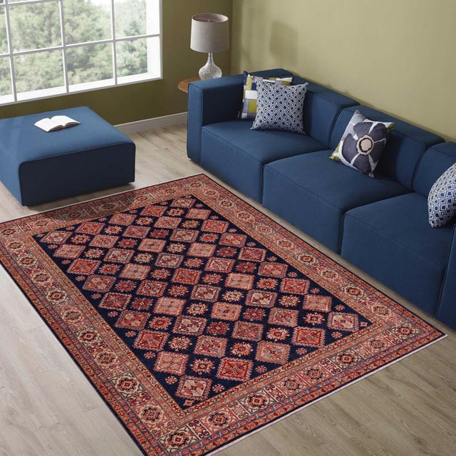 Enhance your home with this exquisite hand-knotted Super Kazak rug, crafted from fine hand-spun wool and dyed with all-...