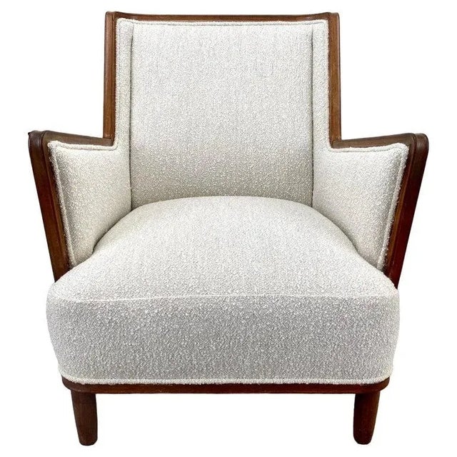 A Mid Century Modern Finish lounge chair crafted by a masterful cabinetmaker. This resplendent piece of furniture boasts a...