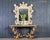 Opulent baroque style console table featuring a honed French limestone top designed by Dennis and Leen Hollywood, CA. The...
