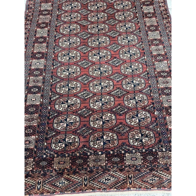 Discover an exquisite late 19th-century Turkmen Bokhara rug, boasting a captivating geometrical design and stunning...