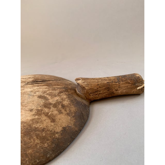 This antique hand carved Chinese rice paddle exudes a wonderful patina and neutral tones that make it ideal to bring...