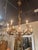The Italian Rococo Gilt Iron Chandeliers are elegant and ornate lighting fixtures designed to add sophistication and style...
