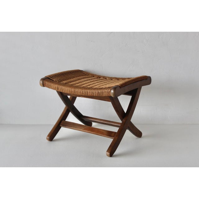 Hans Wegner-style folding stool/ottoman. Beautifully crafted, sturdy, well-made, and also foldable for compact storage. It...