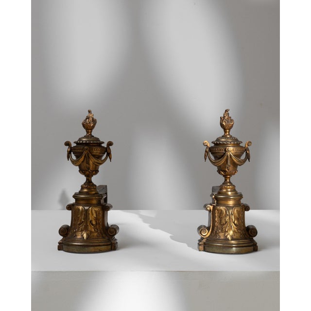 These 19th Century French Cast Iron Fire Dogs boast an ornamental design, rich with the opulent details characteristic of...