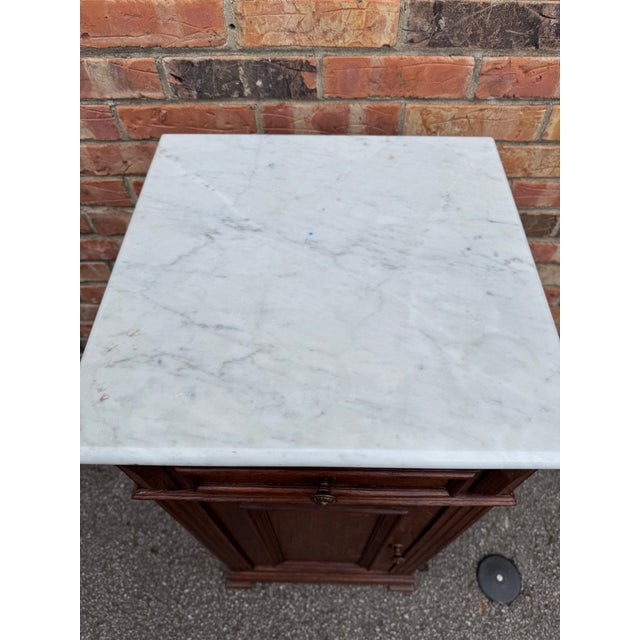 This is a beautiful 19th century bedside table cabinet from France with lovely marble top. This piece can be used as...