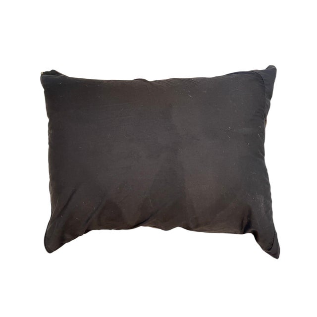 Crafted from authentic Kuba cloth, this 24" x 20" decorative pillow showcases the rich texture, geometric patterns, and...