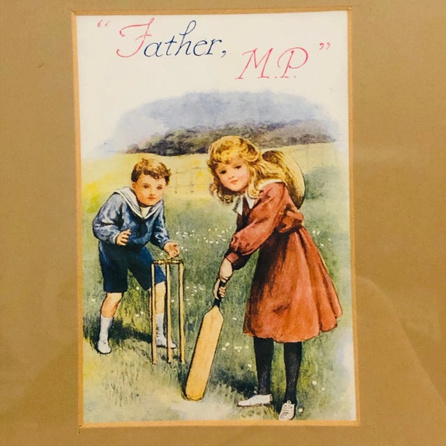 Dating from the early 1900s, this is a most charming "Little Girl and Boy playing Cricket" print in a wooden frame. The...