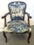 Great updated French salon armchair from the early 20th century. The piece is made of solid fruitwood in a medium tone...