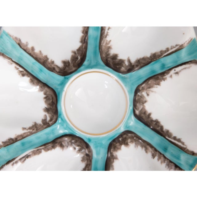 A gorgeous antique French porcelain oyster plate attributed to Limoges, circa 1900. This fine quality oyster plate has six...