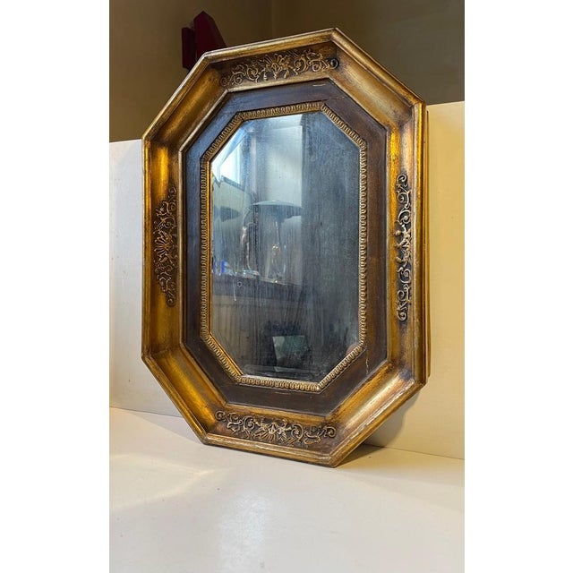 Octagonal Scandinavian wall mirror in gilded wood/oak. It was made in the mid-late 19th century in either Denmark or...