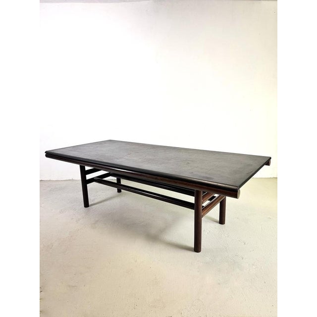 A refined dining table designed by Carlo Scarpa, made in Italy in the 1970s by Simon International. The design fully...