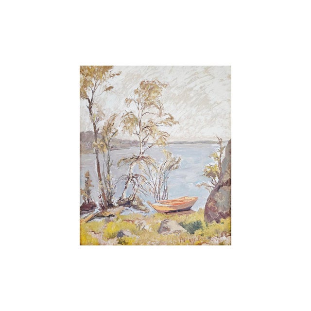 A Swedish lakeside landscape in oil on panel, signed lower right by Folmer Bonnén. A wooden rowboat rests on the shore...