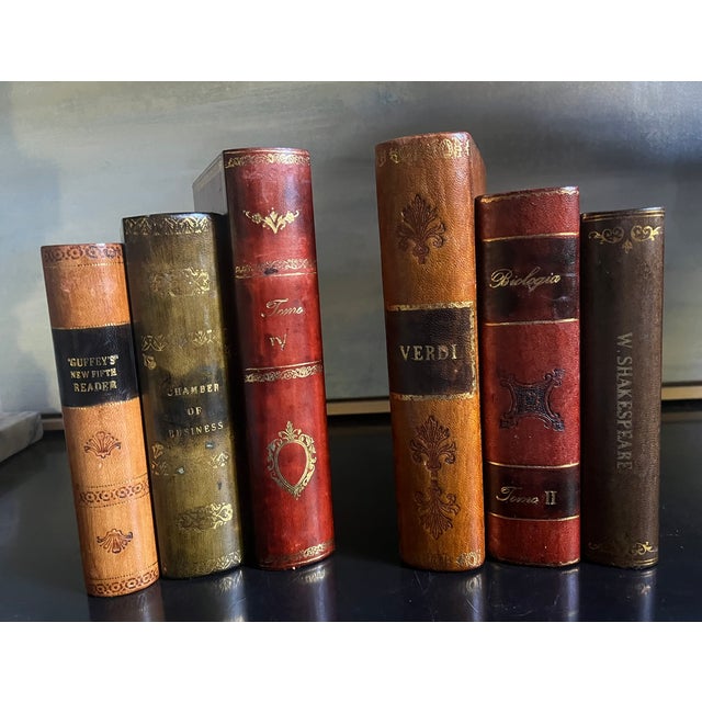 Hand crafted leather bound bookends with gilt lettering, made in Italy around the 1960's. The faux books read on the...