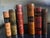 Hand crafted leather bound bookends with gilt lettering, made in Italy around the 1960's. The faux books read on the...
