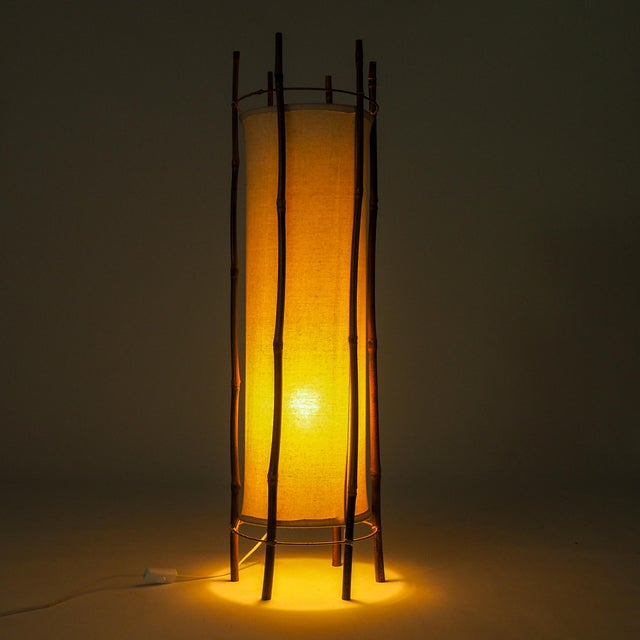 This mid-century French floor lamp by Louis Sognot balances organic texture with clean modernist structure. Crafted in...
