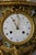A rare Medici-style clock and pair of vases in finely chased and matte gilt bronze and griotte red marble. The clock has a...