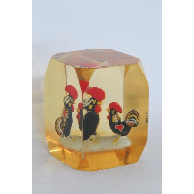 This beautiful Souvenir Paperweight is made of lucite-like material. This gorgeous decorative paperweight features two...