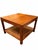 Offered here is a pair a petite square side tables made of walnut with cane shelves. Designed by Jack Cartwright for...