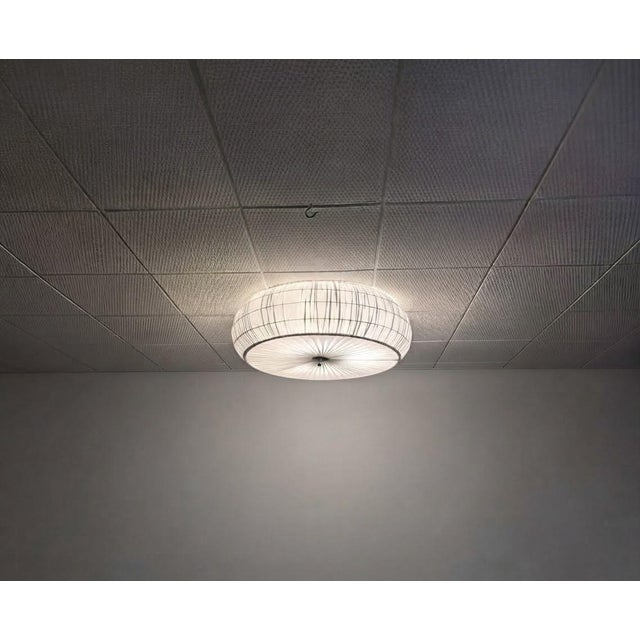 A large 1950s finnish flush mount by stockmann orno oy model 75-204. attributed to lisa johansson-pape. a partially...