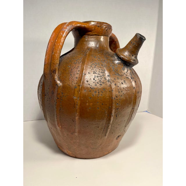 19th Century Antique French Orange Glaze Terracotta Pottery Mélard Walnut Oil Jug Presenting a splendid mélard originating...