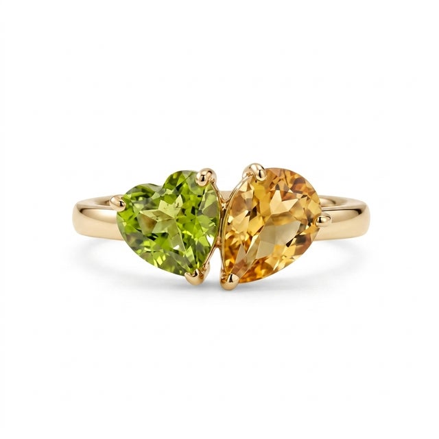 Celebrate harmony and elegance with this beautifully crafted two-stone gemstone ring, featuring a vibrant 5mm heart-cut...