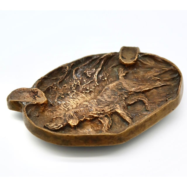 Antique bronze ashtray with hunting dog motif. No maker's marks. Some light tarnish.