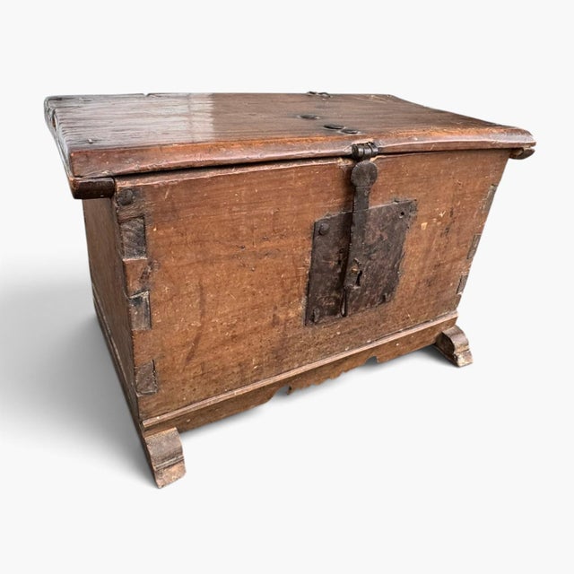 This antique 18th‑century wooden trunk box is a beautiful example of early, primitive craftsmanship. Built with hand‑cut...