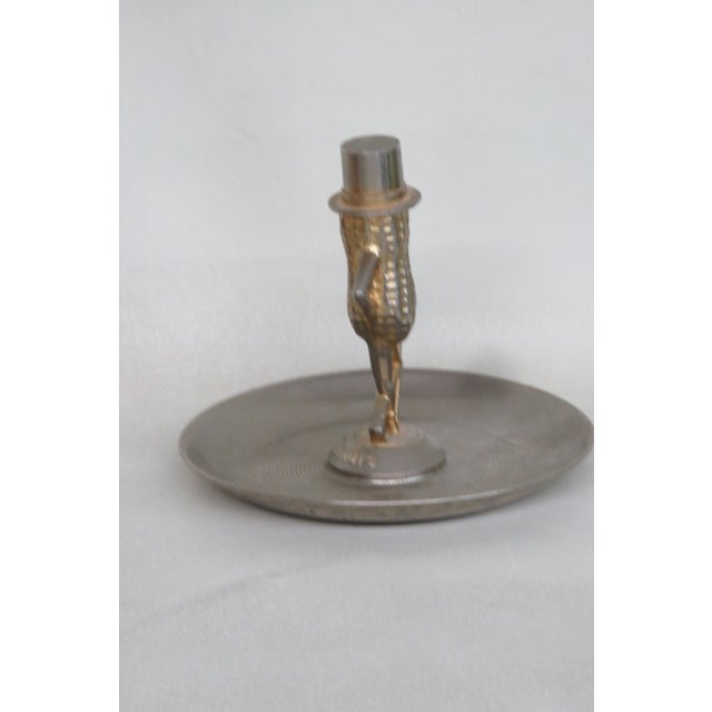 This gorgeous Peanut Dish is made of metal, and it is stamped as being made in the US by Diecasters Inc. This Mr. Peanut...