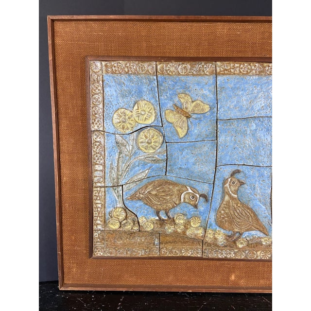 An unusual sculpted ceramic tile rectangular wall hanging featuring individual tiles with bas relief style decoration. The...