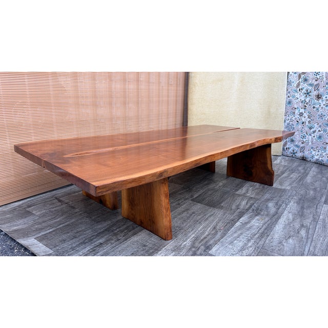 Vintage Organic Live-edge Solid Wood Coffee Table in the Mira Nakashima Style. Circa 1980s. Features two solid wood planks...