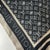 Louis Vuitton Black Monogram 100% Silk Scarf. Large square with a black ground printed with white Monogram flowers and LV...