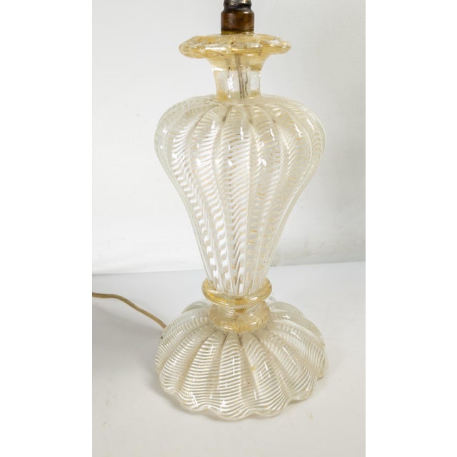 We are selling this gorgeous Italian murano glass lamp. This lamp is very professionally made with white in clear...