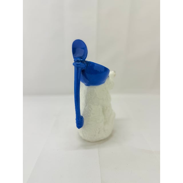 This rare and whimsical Antique German porcelain syrup pitcher is crafted in the form of a polar bear, embodying both...