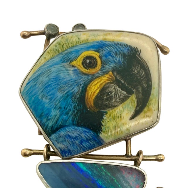 This is a beautifully crafted mixed-metal hinged brooch featuring both 14K and sterling silver, signed "AW". The top...