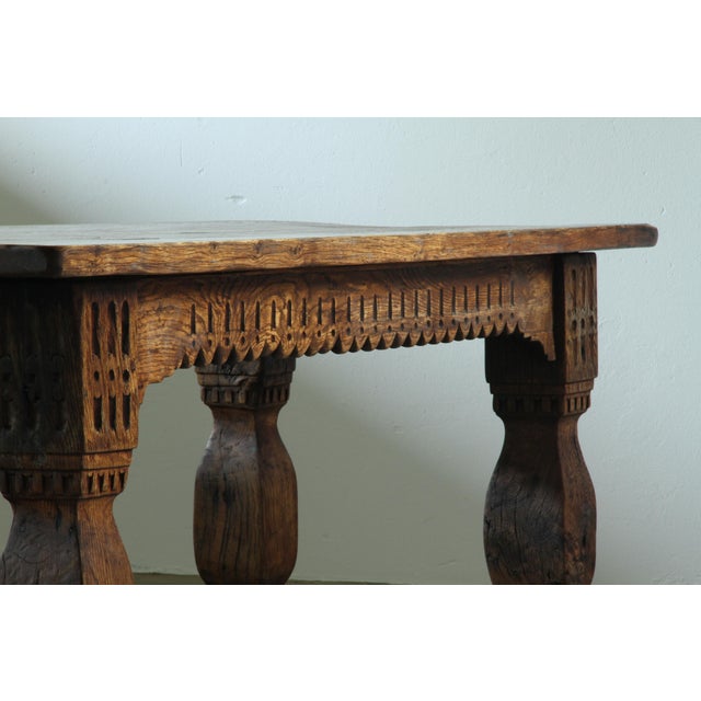 This is a truly grand and powerful piece. A large, heavy Baroque-style dining table, built in the early 1900s, likely...