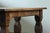 This is a truly grand and powerful piece. A large, heavy Baroque-style dining table, built in the early 1900s, likely...