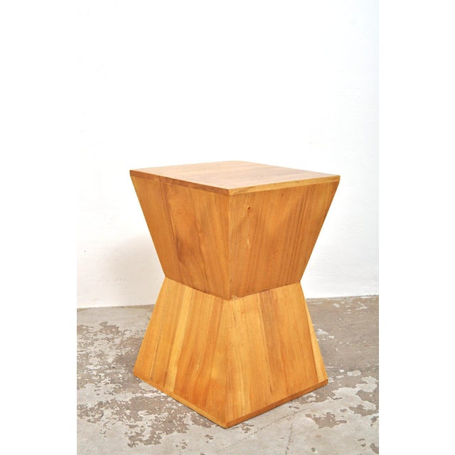 These pyramid tables are beautifully made. They may be lightweight, but they're also sturdy. They're likely made of maple....