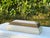 Vintage decorative box with a distinctive parchment-style covering in an intentionally crackled, aged finish. The stepped...