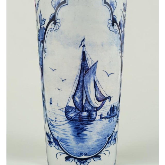 Elegant vintage dutch delft blue vase, made and hand-painted in the netherlands during the 1950s. This tall cylindrical...