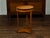 An Austrian Biedermeier period walnut guéridon table from the mid 19th century, with ebonized rim and lower shelf. Created...
