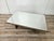 An elegant Italian coffee table from the 1960s, characterized by a simple, architectural geometry, clearly echoing the...