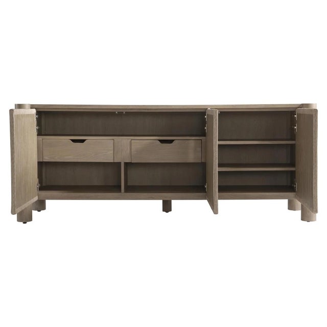 A Bernhardt Kiona buffet in Sandbar white oak, with twisted rope wrapping the door fronts and end panels. Four cylindrical...