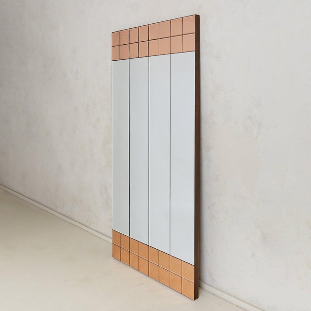 An Italian floor-length mirror from the 1970s, sheathed in rose gold mirrored tiles. Over six feet tall, the towering form...