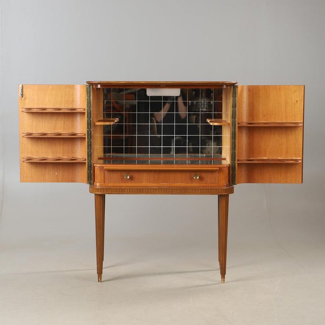 Classic Swedish Grace / Swedish Modern bar cabinet from well known Forenade Mobler AB. Crafted in 1940s with excellent...