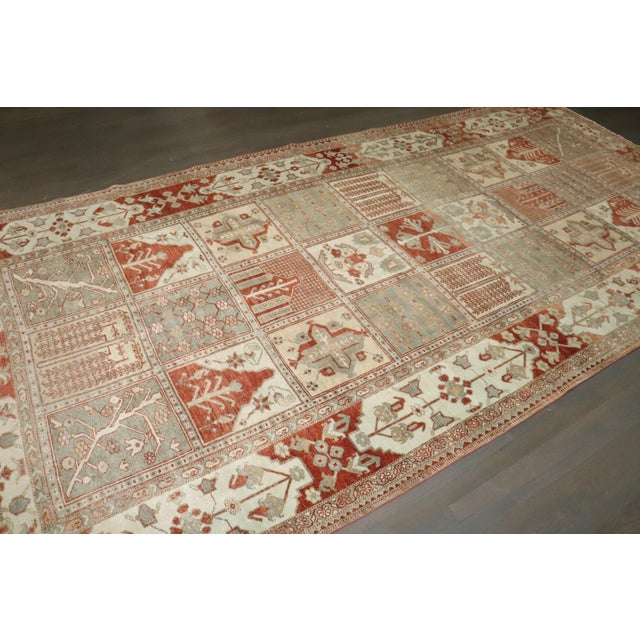 1930s Persian Bakhtiari Gallery size rug with an all over garden panel motif Details rug no. j4086 size 6' 6" x 13' 1"...