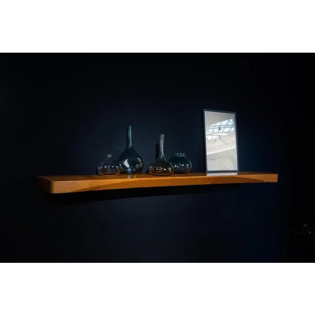 This decorative set of “Crazy Bottles,” crafted by Claude and Florence Morin in the 1970s, showcases the unique artistry...