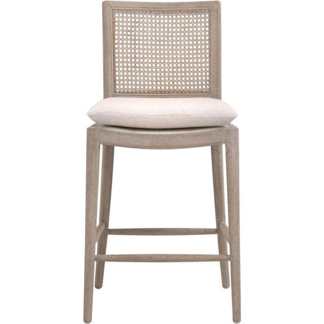 The Blume Counter Stool by Essentials For Living is a perfect blend of traditional charm and modern style, suitable for...