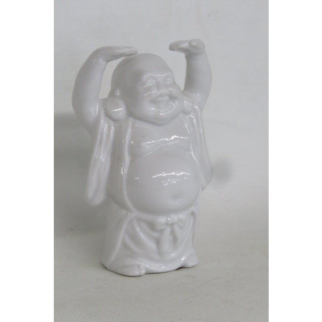 This darling Laughing Buddha Figurine is made out of ceramic. This lovely small figurine depicts Buddha smiling/laughing...