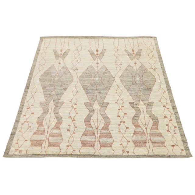 Elevate your space with this contemporary Moroccan-inspired hand-knotted wool rug. Featuring a minimalist palette of...