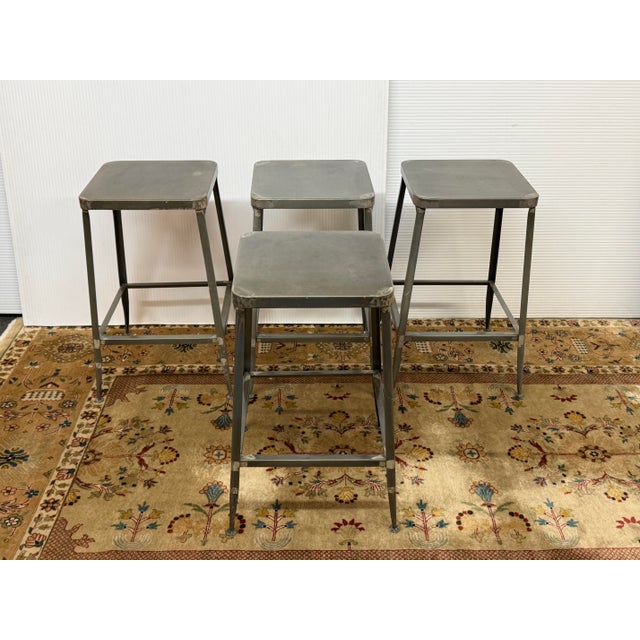 Design Plus Gallery presents a Set of Four Flint Counter Stools from CB2. These stools are the epitome of industrial glam....